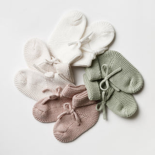 Circle of knitted baby booties 