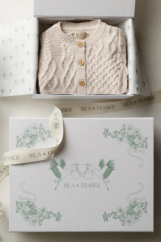 Open Gift Box with tissue paper and a Knitted Baby Cardigan 