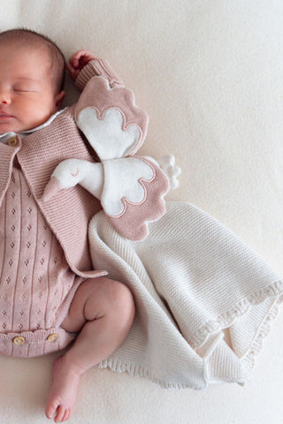 Sleeping Baby in Rose Pink Knitwear with Rose Pink Stork Baby Comforter