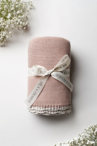 Rose Pink Knitted Baby Blanket with contrast scalloped trim tied with an Isla & Fraser ribbon