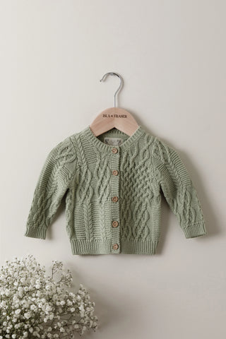 Sage Cable Knit Baby Cardigan on an Isla & Fraser wooden hanger
