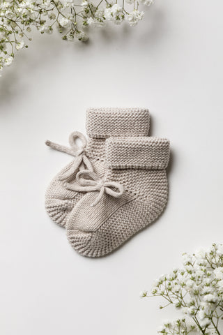 Knitted baby bow booties in grey