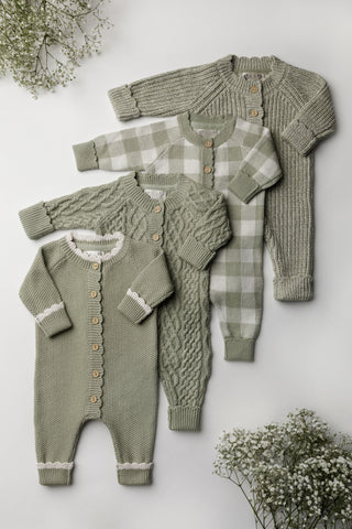 Four sage green knitted baby rompers in different stitches
