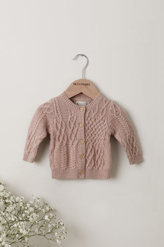 Rose pink cable knit baby cardigan on Isla & Fraser hanger 