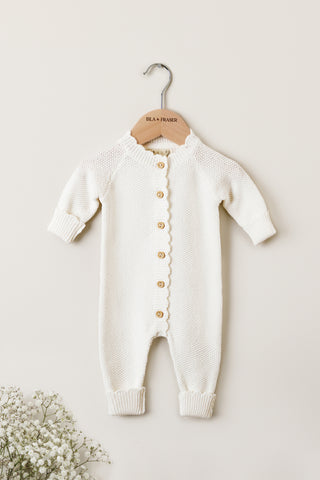 Knitted Baby Romper on a wooden Isla & Fraser hanger