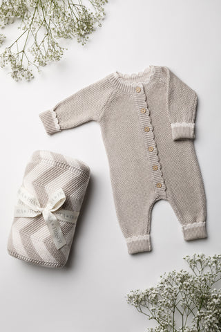 Grey stripe baby blanket tied with an Isla & Fraser ribbon and a grey knitted baby romper