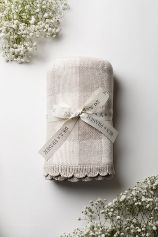 Neutral check baby blanket tied with an Isla & Fraser ribbon