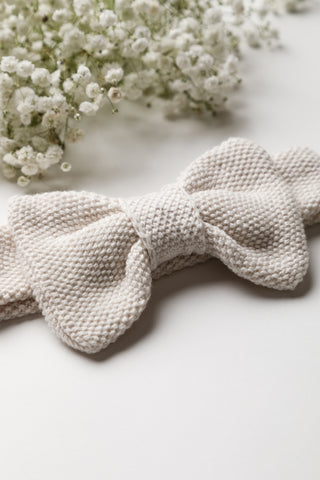 Close up of bow stitch detail on headband